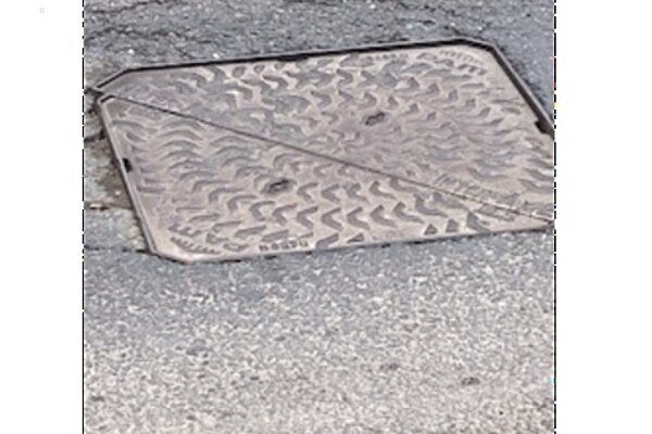 pothole with utility lid